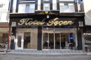 a hotel sign on the front of a store at Hotel Iscen in Mustafakemalpaşa
