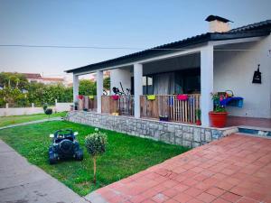 a house with a motorcycle parked in the yard at Casa do Trevo in Salir de Porto +42 photos