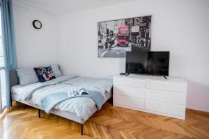 Posteľ alebo postele v izbe v ubytovaní SuperApart Plac Dąbrowskiego 12