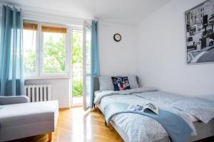 Posteľ alebo postele v izbe v ubytovaní SuperApart Plac Dąbrowskiego 12