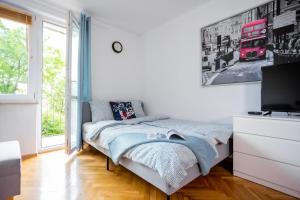 Posteľ alebo postele v izbe v ubytovaní SuperApart Plac Dąbrowskiego 12