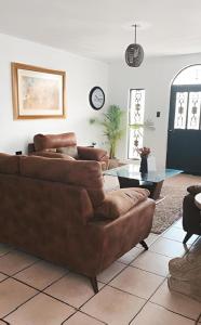 a living room with two couches and a table at Casa Ragma in Parras de la Fuente