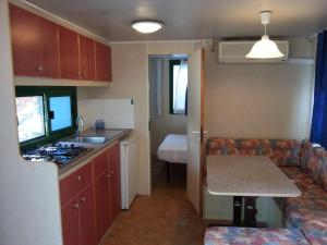 A kitchen or kitchenette at Villaggio Camping Europa