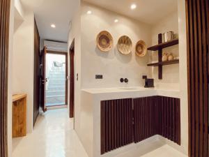 a bathroom with a sink and a counter at Archo Suites Pythagoreio in Pythagoreio +23 photos