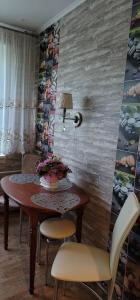 a dining room with a table and some chairs at Ventas in Liepāja