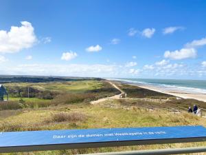 a view of the beach from the top of a hill at Vakantiehuis Domburg Cabanas DO37 in Domburg