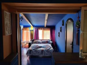 מיטה או מיטות בחדר ב-Vila Ella