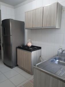 Una cocina o zona de cocina en Apartamento Aconchegante em Itapema
