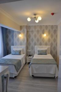 Ένα ή περισσότερα κρεβάτια σε δωμάτιο στο Hotel Iscen