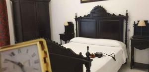 Postel nebo postele na pokoji v ubytování Hostal Ciudad Trigueros