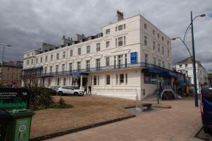 a large white building on a city street at NELSON Hotel in Great Yarmouth