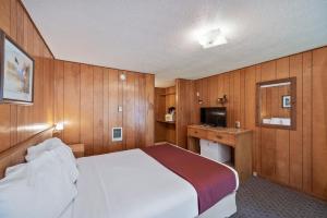 Voodi või voodid majutusasutuse Birch Glen Lodge toas