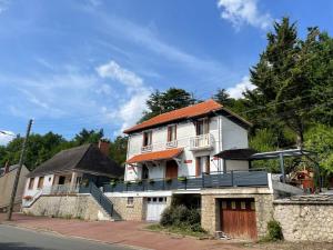 a large white house with an orange roof at VILLULA in Gien