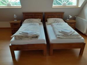 Postel nebo postele na pokoji v ubytování Vila Křenov