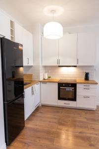 A kitchen or kitchenette at Apartamenty Termalne Dobry Klimat