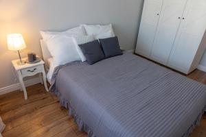 Cama ou camas em um quarto em Apartamenty Termalne Dobry Klimat