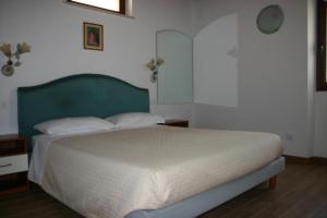 Posteľ alebo postele v izbe v ubytovaní A casa di Giò