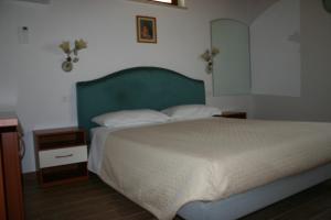 Posteľ alebo postele v izbe v ubytovaní A casa di Giò