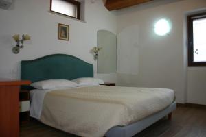 Posteľ alebo postele v izbe v ubytovaní A casa di Giò
