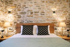 Postel nebo postele na pokoji v ubytování Archontiko Epirus 1