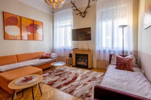 Televízia a/alebo spoločenská miestnosť v ubytovaní Central Design Apartment