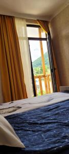 Postel nebo postele na pokoji v ubytování Guest House Guli