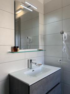 a bathroom with a sink and a mirror at Civico 49 Bed&Breakfast in Lecce +45 photos