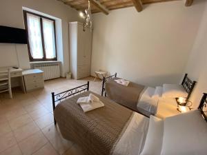 A bed or beds in a room at B&B I Giardini