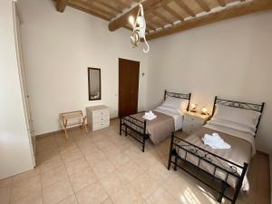 A bed or beds in a room at B&B I Giardini