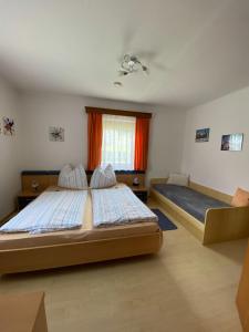 A bed or beds in a room at Ferienhaus Mörtl Még 26 kép