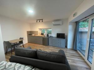 a living room with a couch and a table at Azimut Hiša in Tolmin