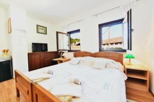 Postel nebo postele na pokoji v ubytování Guest House Vučeta