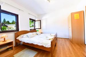 Postel nebo postele na pokoji v ubytování Guest House Vučeta