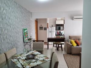 a living room with a couch and a table at Nautilus Paradise em Penha/SC in Penha