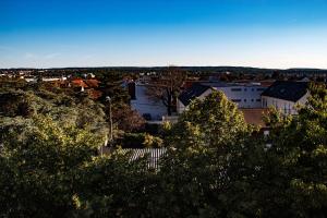 a view of a city with trees and buildings at Quennet in Carrières-sous-Poissy