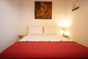 A bed or beds in a room at Casa de la Vita