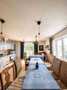 a living room with a table and a couch at Istebna 401 MURY in Istebna