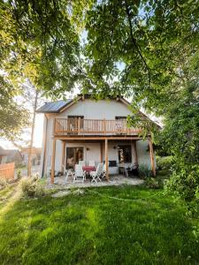 a house with a deck and a patio at Istebna 401 MURY in Istebna