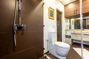 a bathroom with a toilet and a sink at The Lemonary Marrakech in Marrakech