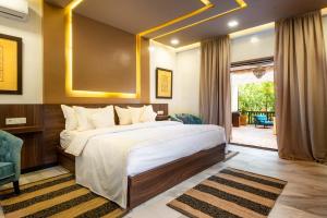 a bedroom with a large bed and a patio at The Lemonary Marrakech in Marrakech