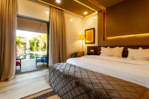a hotel room with a bed and a balcony at The Lemonary Marrakech in Marrakech