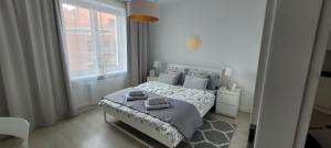 Posteľ alebo postele v izbe v ubytovaní Apartament Centrum Szczecin