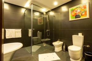 a bathroom with a toilet and a sink and a shower at The Lemonary Marrakech in Marrakech