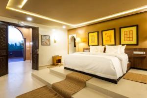 a bedroom with a large bed in a room at The Lemonary Marrakech in Marrakech