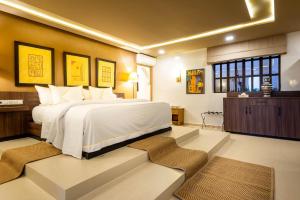 a bedroom with a large white bed in a room at The Lemonary Marrakech in Marrakech