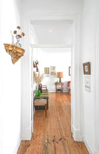 a room with a hallway with a wooden floor at Donapart in Lisbon