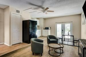 a living room with a table and chairs and a kitchen at Quiet Location Duplex House - Minutes Away from Everything - Winter Park, Florida in Orlando