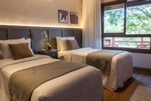 Postel nebo postele na pokoji v ubytování Natureza Eco Lodge