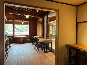 a dining room with a table and chairs at Norikura Kogen - irodori - - Vacation STAY 91530v in Matsumoto