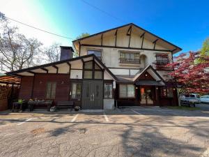 a large house with a gambrel roof at Norikura Kogen - irodori - - Vacation STAY 91527v in Matsumoto